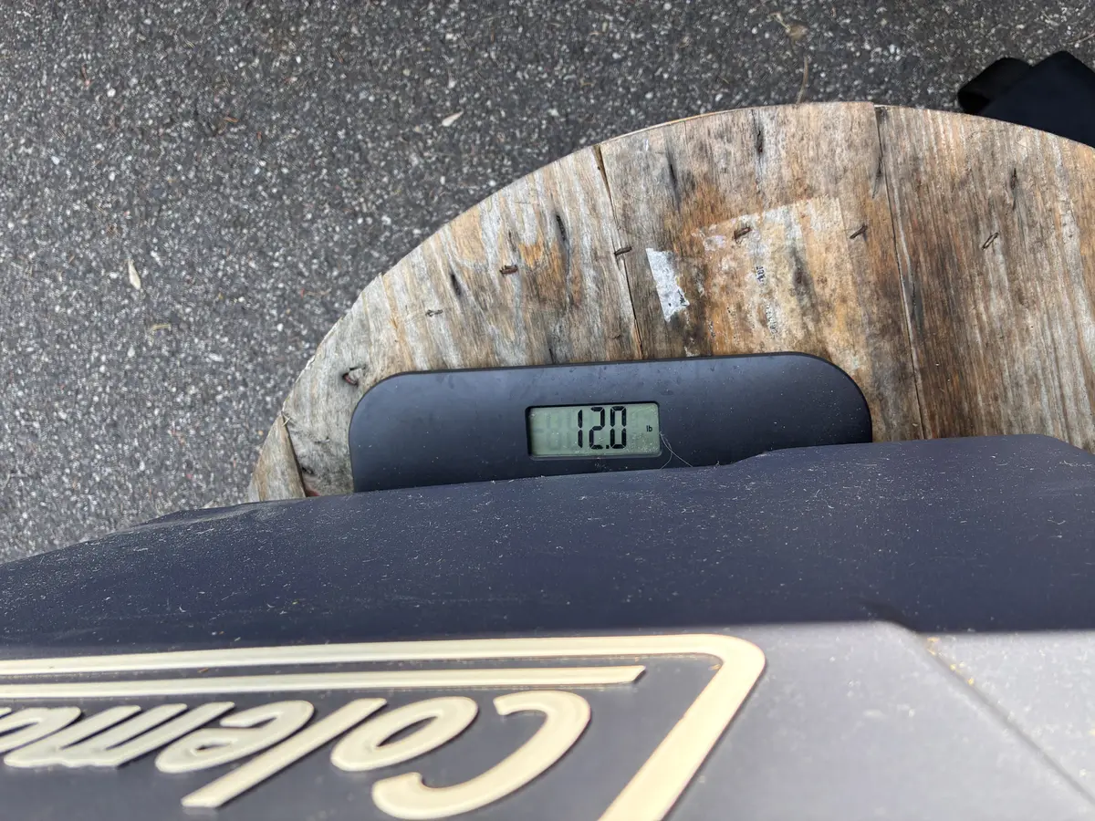 Digital scale showing 12.0 lbs — Coleman cooler tare weight